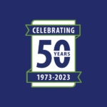 Celebrating 50 years, 1973-2023, in white text on a blue background, framed with a green outline and banner.