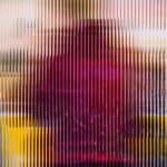 A person with a red shirt is partially visible behind a textured glass panel, creating a blurred effect with vertical lines.