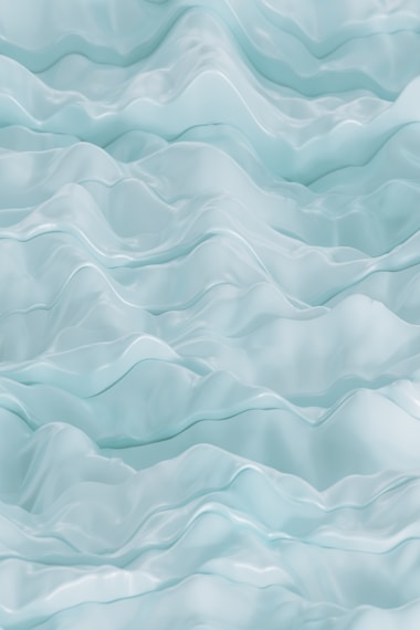 Light blue wavy texture resembling smooth, flowing fabric or water, with soft peaks and valleys creating a sense of depth.