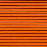 Horizontal lines of varying thickness in a bright orange color, creating a textured, striped pattern.