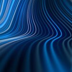 Curving lines in various shades of blue create a flowing wave pattern against a dark background.