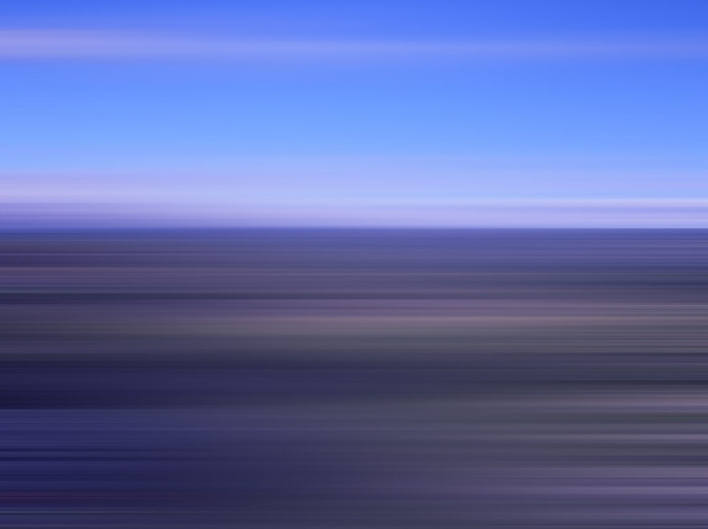 Abstract ocean waves with blue sky