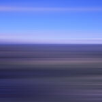 Abstract ocean waves with blue sky