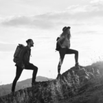 Two people hiking up a mountain